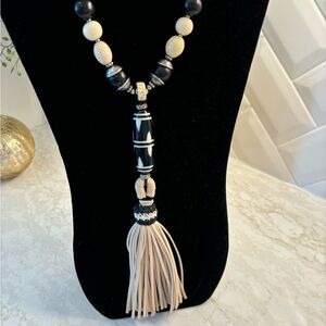 Chico’s long black and tan tasseled necklace